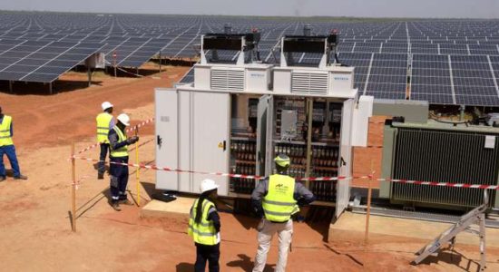 Technicians operate electrical cabinets on October 22, 2016 during the opening ceremony of a new photovoltaic energy production site in Bokhol.
Senegal put into service one of sub-Saharan Africa's largest solar energy projects Saturday as it pushes to become a regional player in renewables on a continent where the majority remain off-grid. / AFP PHOTO / SEYLLOU